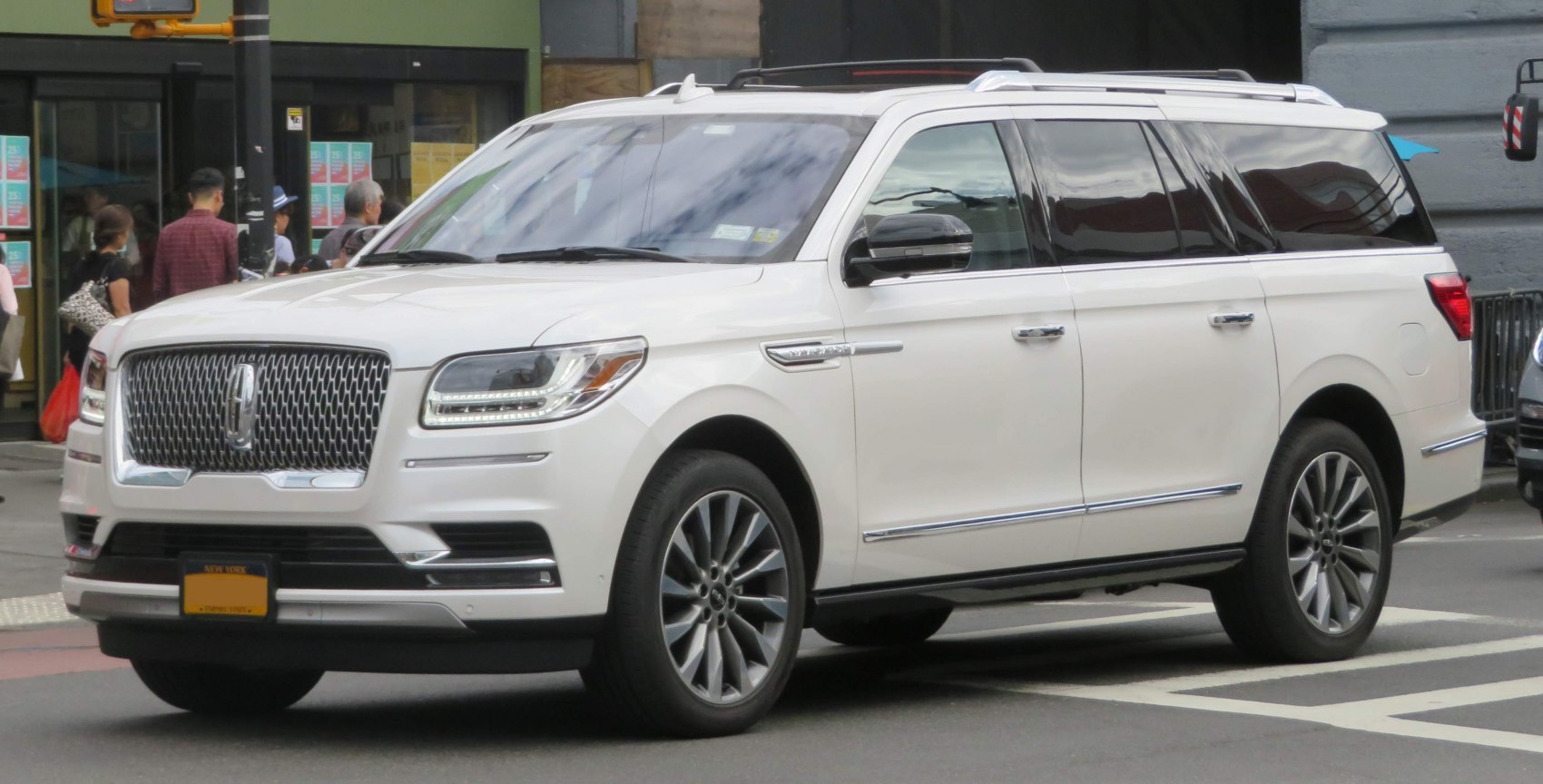 Front-side view with signature grille and LED headlights