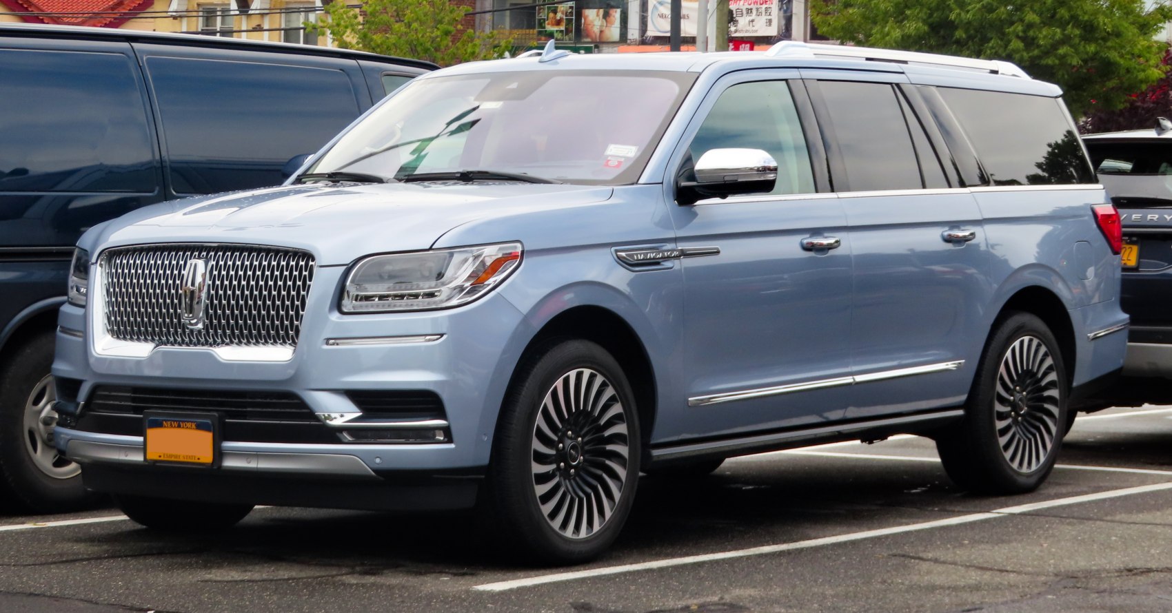 Large luxury SUV with prominent grille and stylish wheels