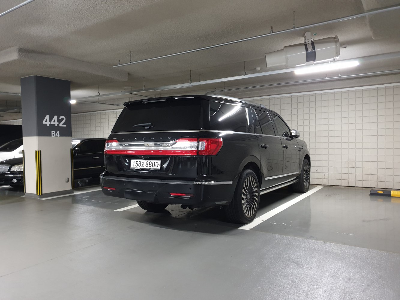 Rear view of black SUV with LED taillights and chrome accents