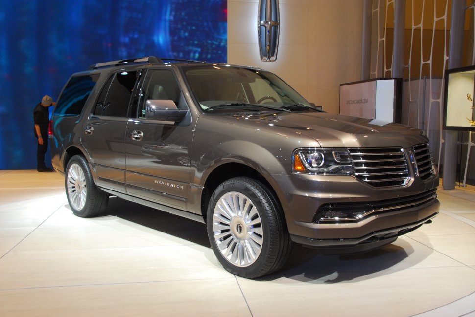 Luxury SUV with chrome grille and distinctive large alloy wheels