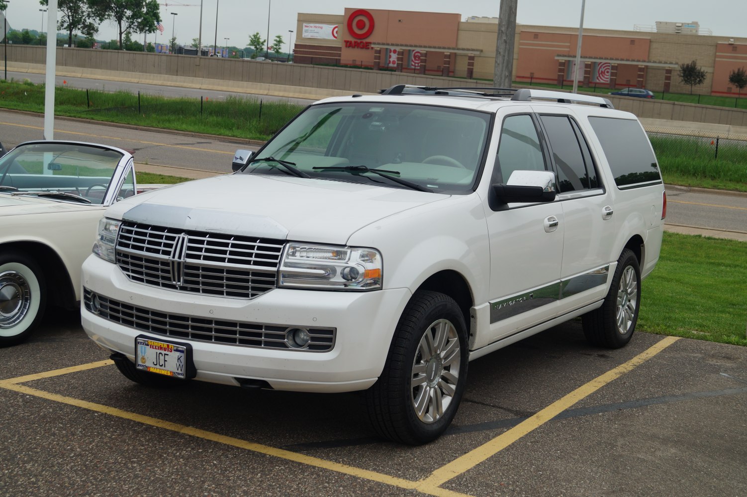 Luxury full-size SUV with chrome grille and roof rails