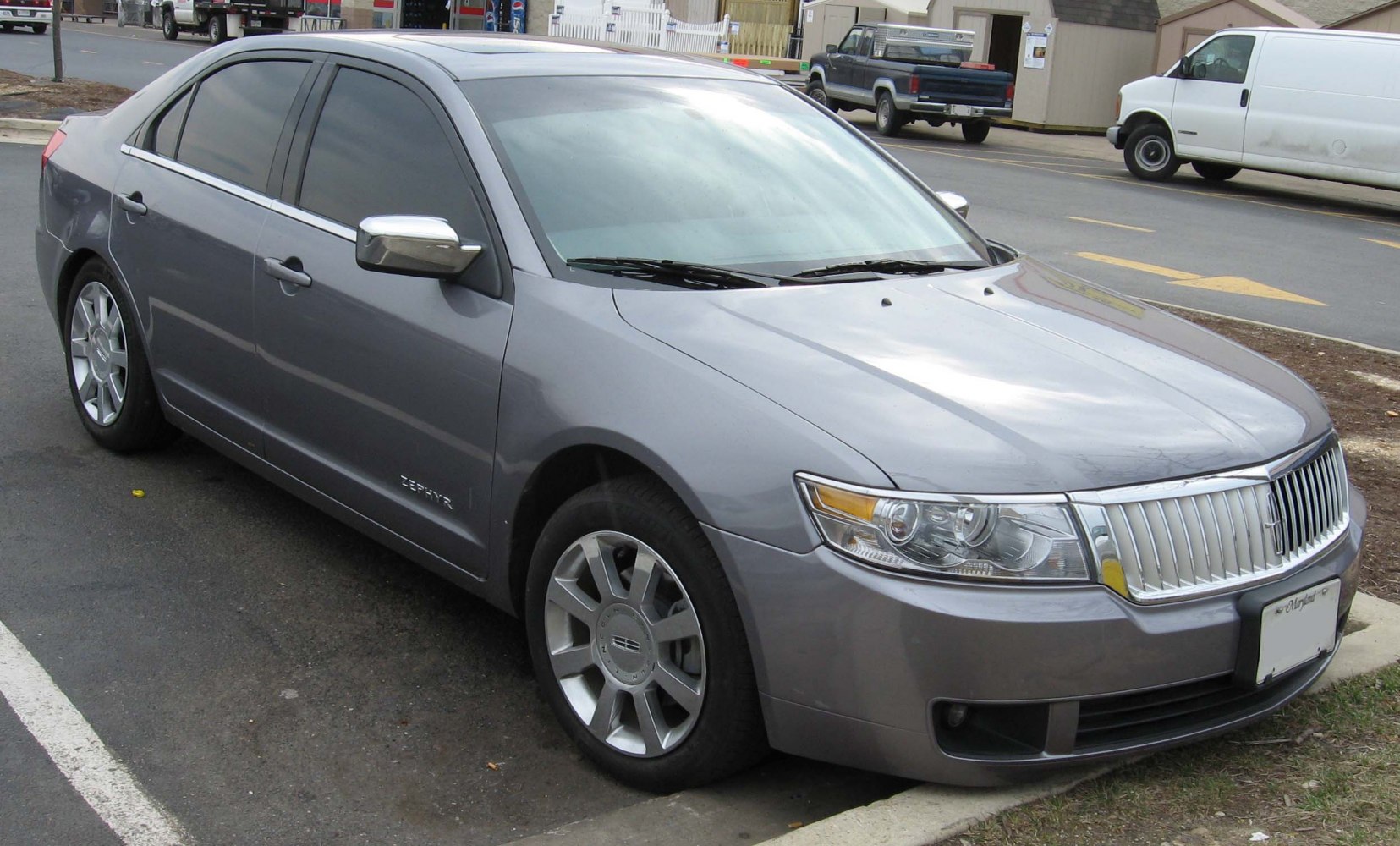 Front side view with chrome grille and alloy wheels
