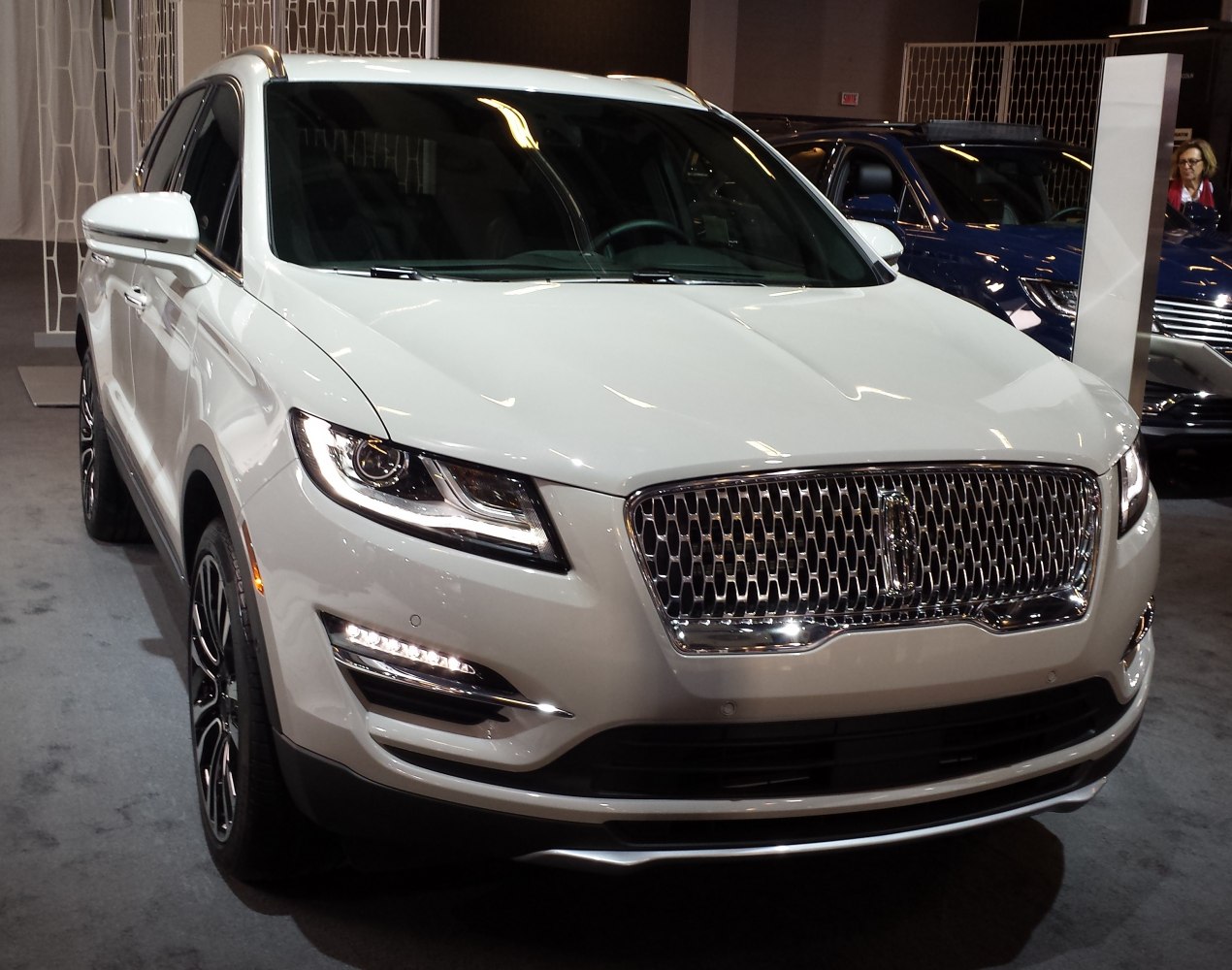 Front view of SUV with chrome grille and LED headlights