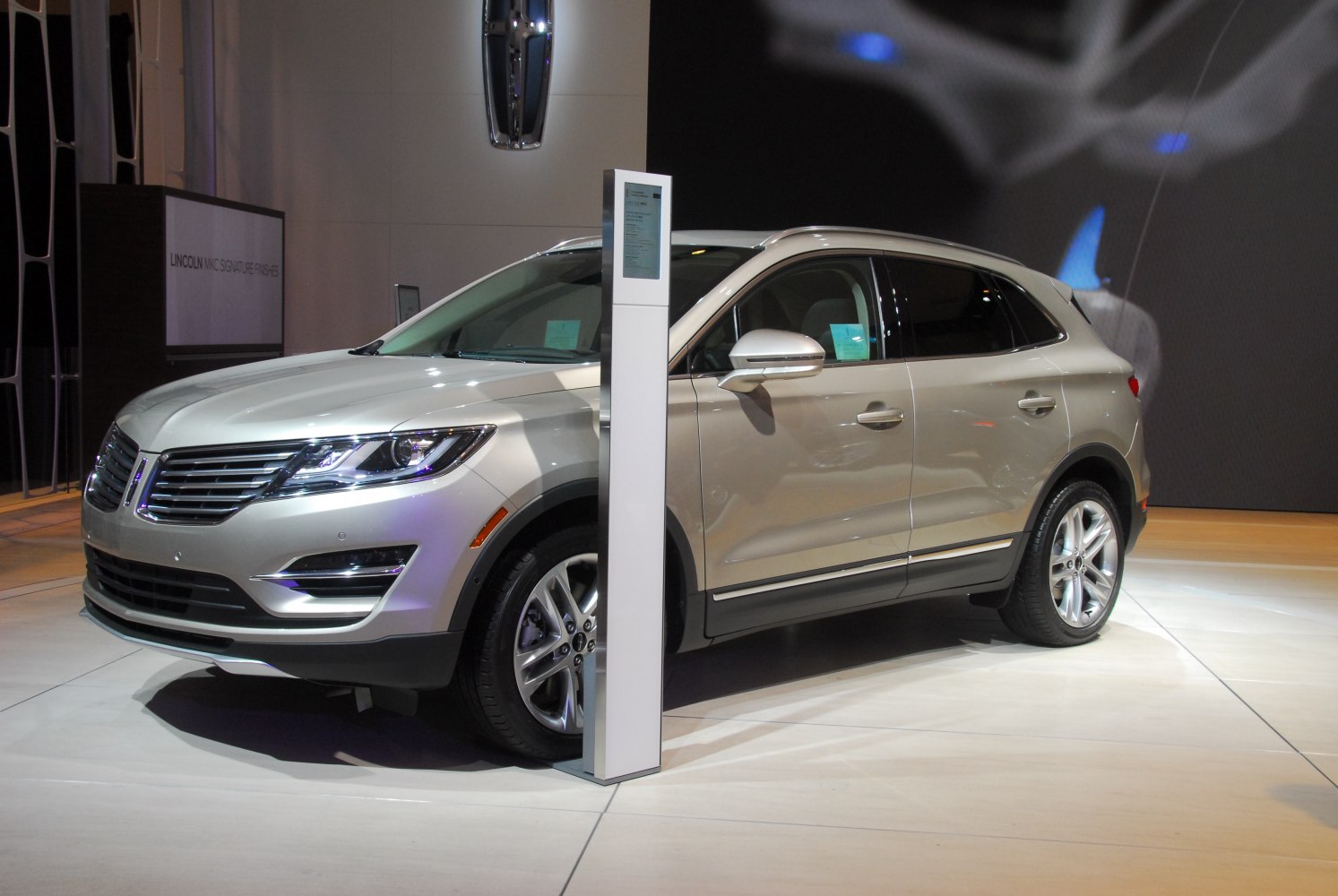 Silver luxury compact SUV with LED headlights and alloy wheels
