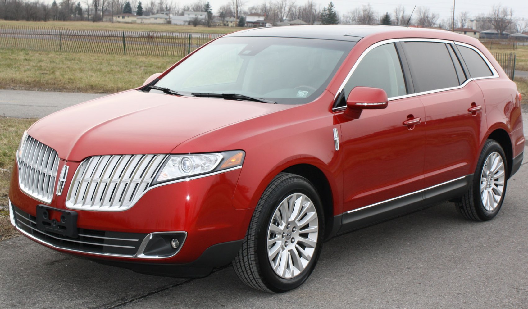Front and side view of SUV with chrome grille and sleek design