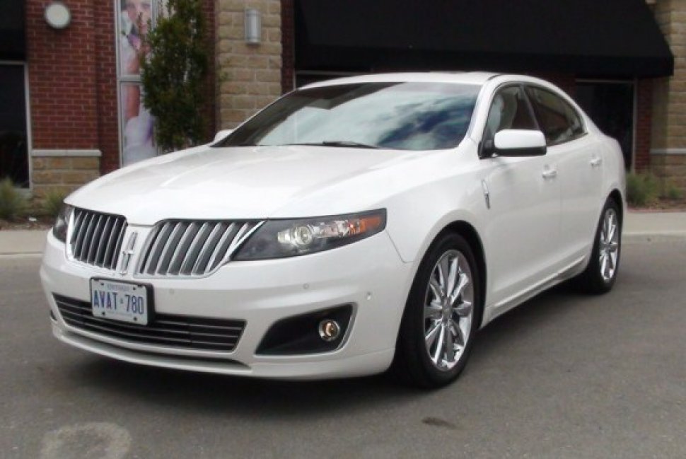 Front angled view showing chrome grille and headlight design