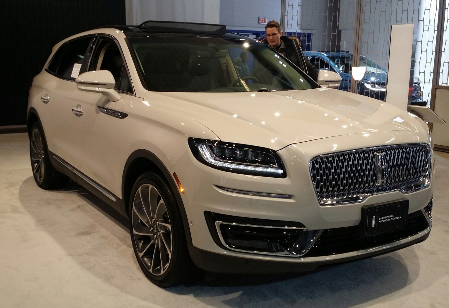 Front and side view of modern SUV with LED headlights and chrome grille
