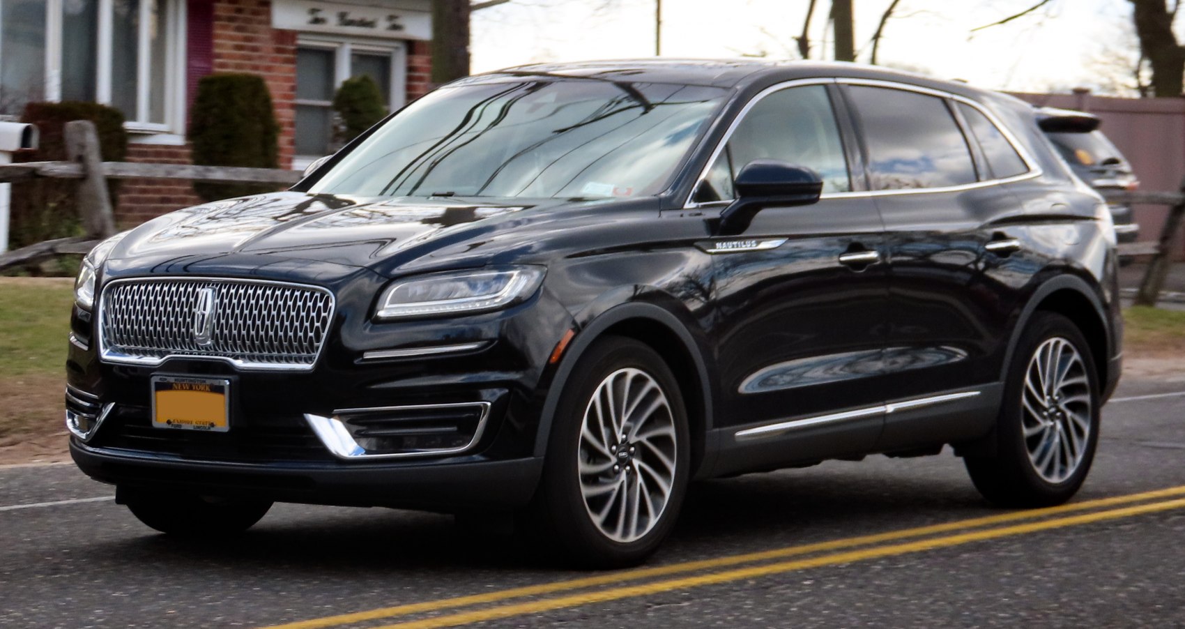 Luxury mid-size SUV with distinctive mesh grille and alloy wheels