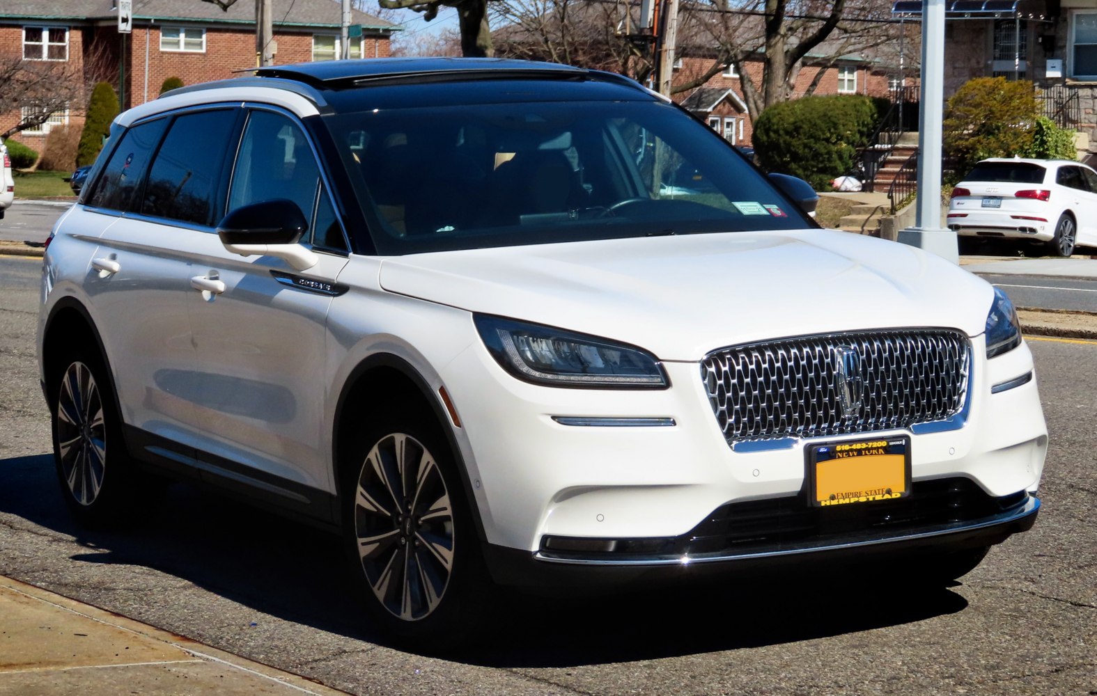 Front view of SUV with chrome mesh grille and LED headlights
