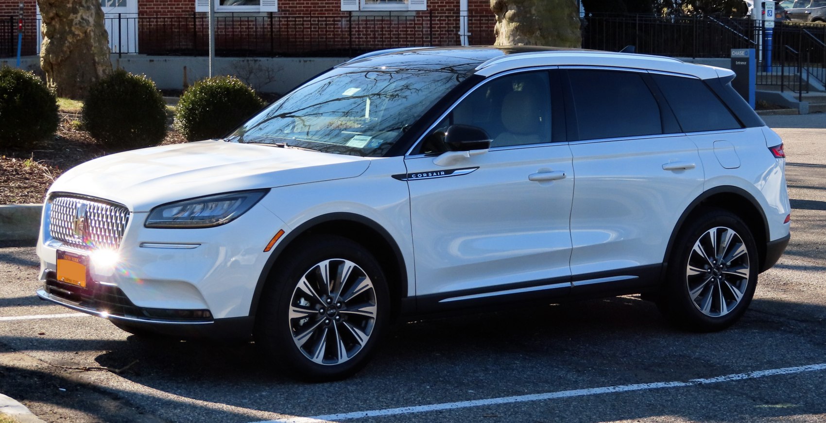 White luxury SUV with LED headlights and alloy wheels