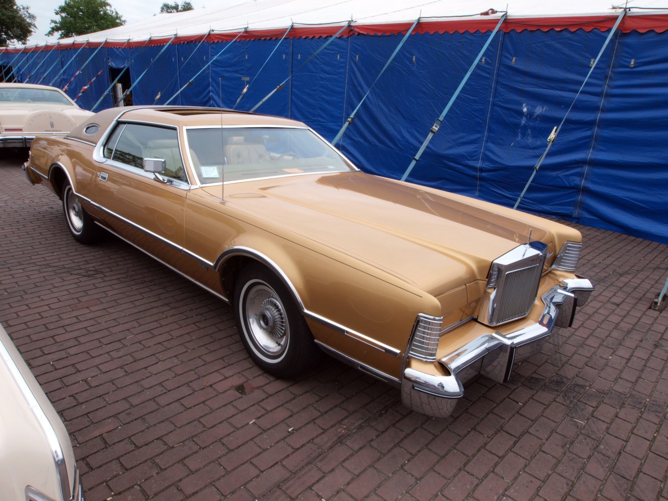 1973 facelift, gold coupe with long hood and chrome grille