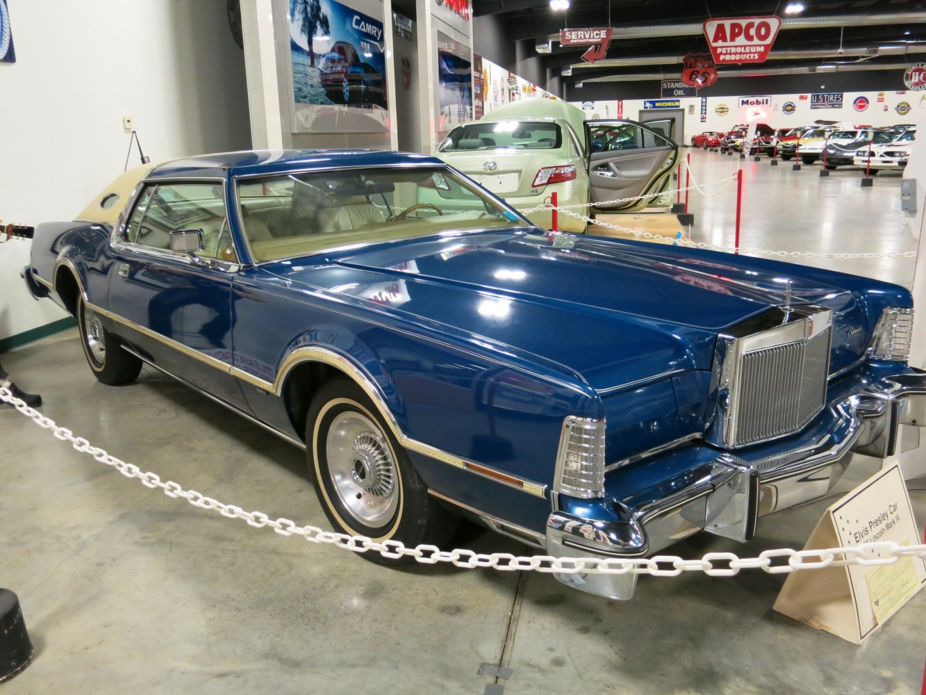 Vintage luxury coupe with prominent chrome grille and angular body design