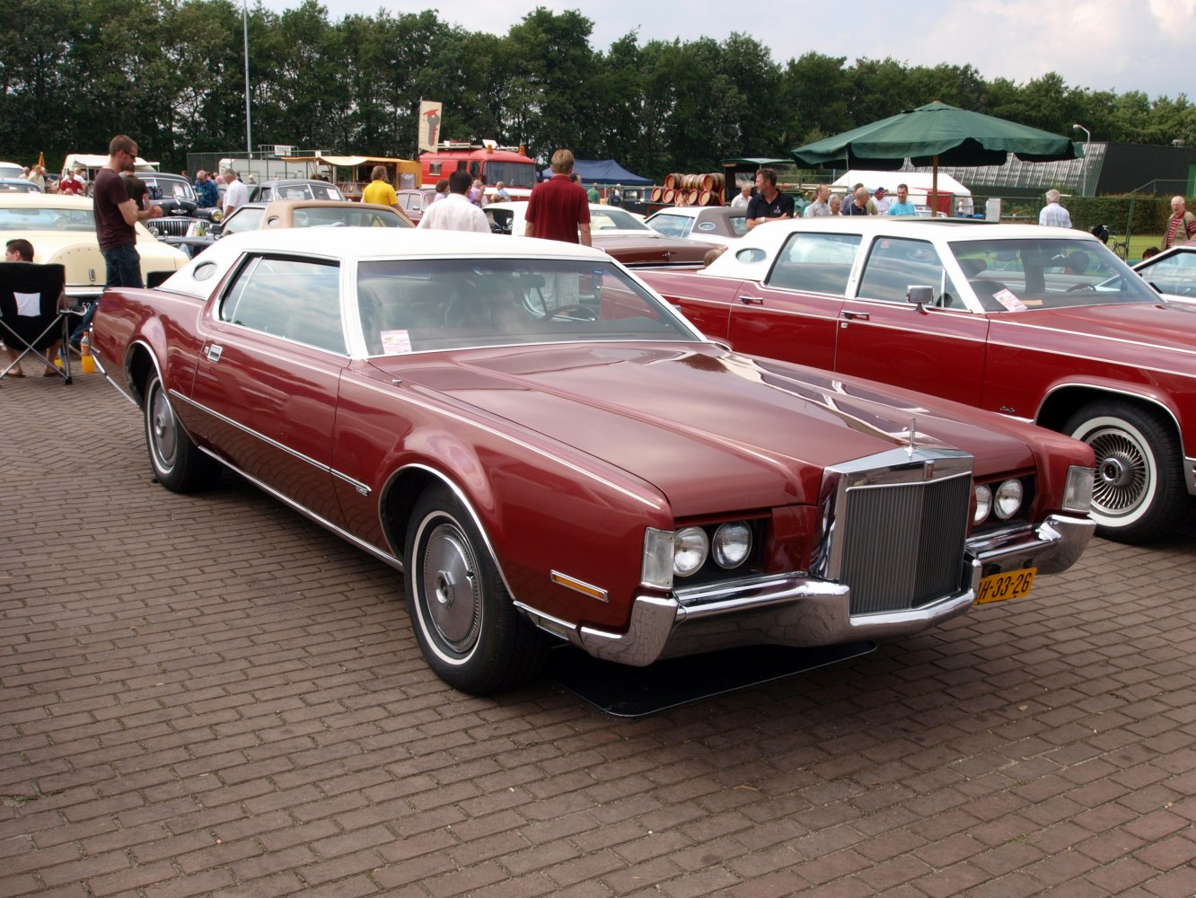 Vintage front grille with quad round headlights and chrome bumper.
