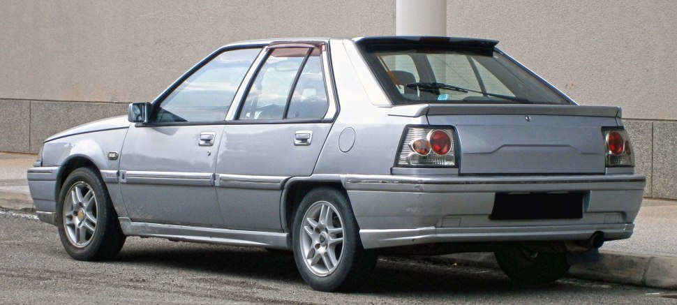 Silver four-door sedan with unique rear light cluster and alloy wheels
