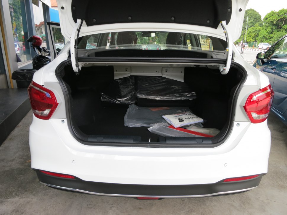 Open rear trunk with spacious boot and visible cargo items