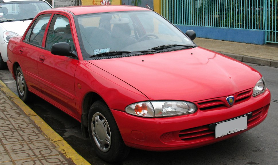 Red compact sedan with classic front-end design