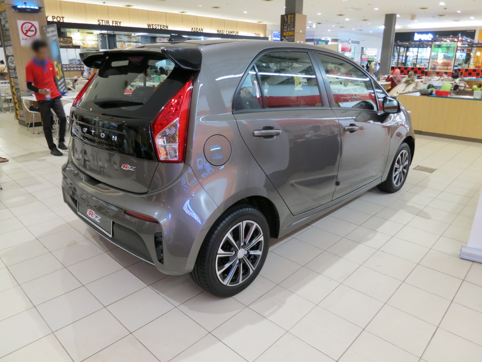 Rear side view with spoiler and alloy wheels of compact hatchback.