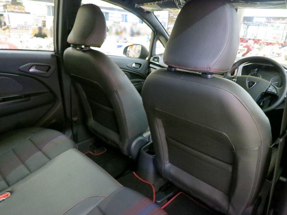 Rear seating and front seat backs with leather upholstery in the car interior