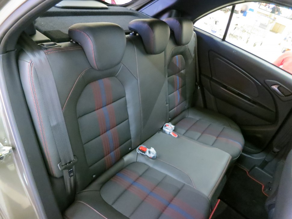 Leather rear seats with multi-color stitching and three headrests