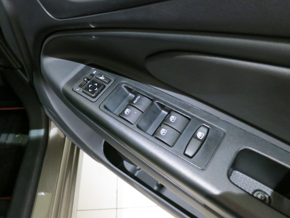 Power window and mirror control panel on door interior