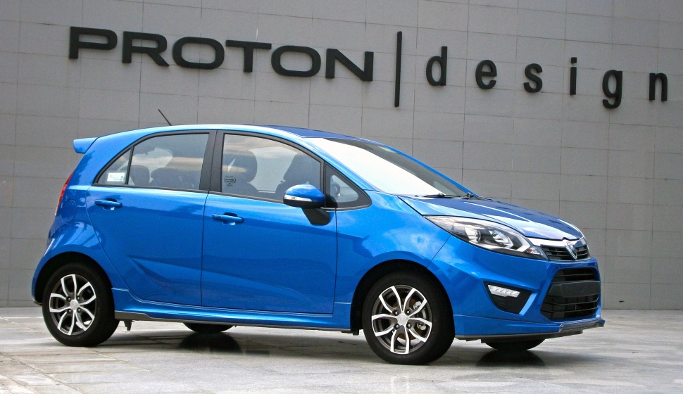 Blue compact hatchback with sporty alloy wheels and modern headlights