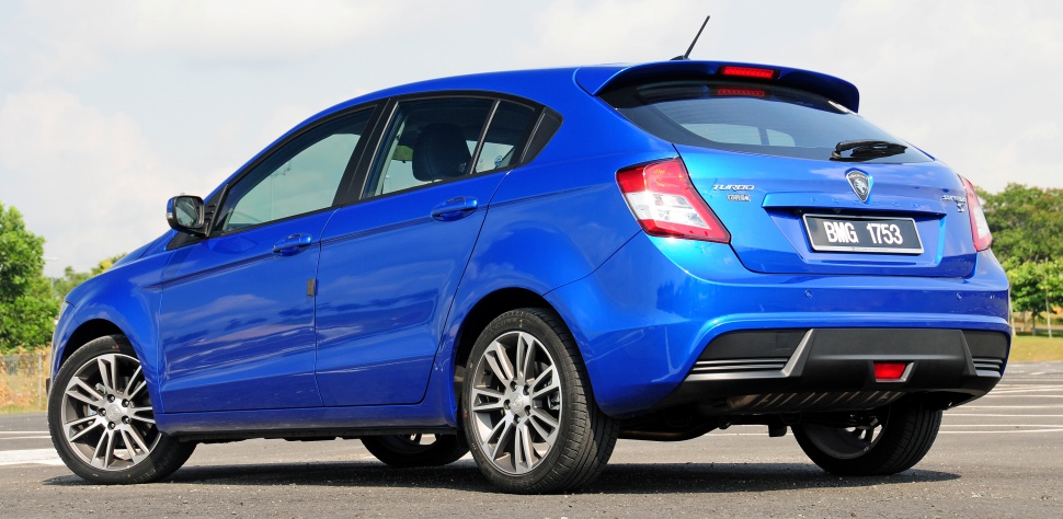 Blue hatchback rear view with alloy wheels and sporty design