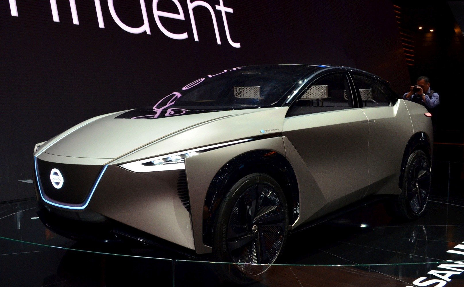Futuristic electric SUV with sharp LED headlights and aerodynamic body.