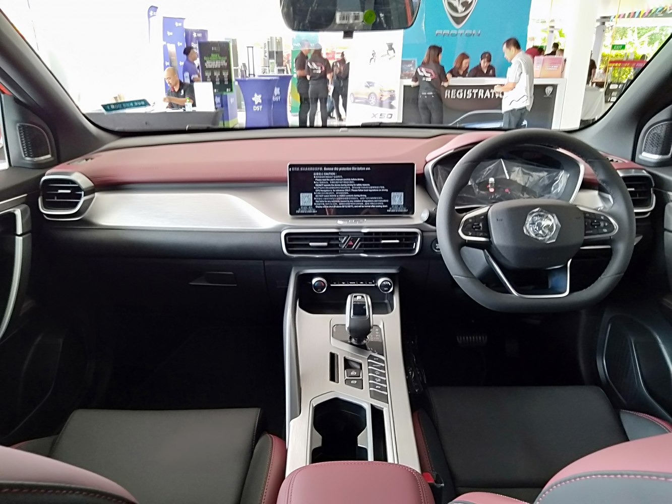 Digital infotainment screen and steering wheel in modern SUV interior