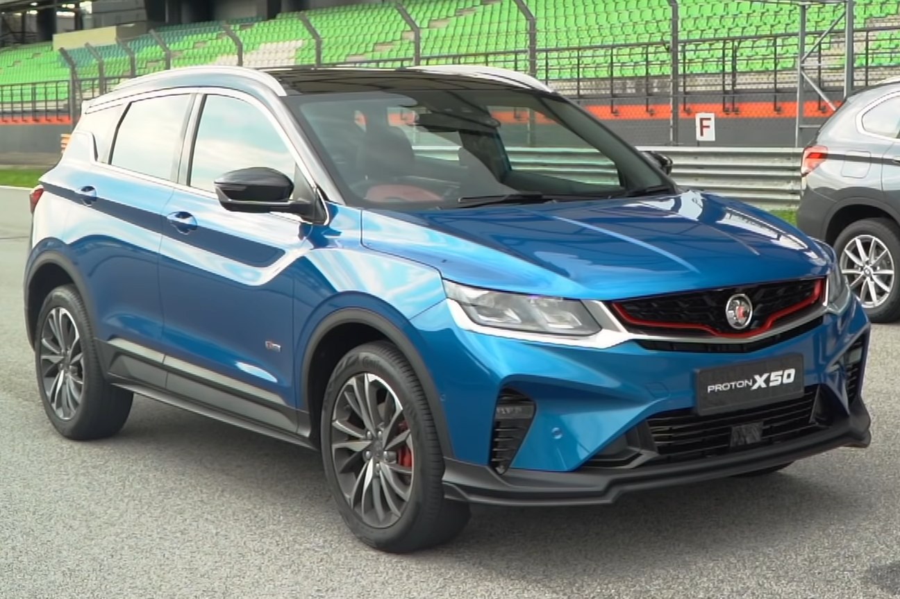 Blue SUV front-side view with red grille accents and black trim