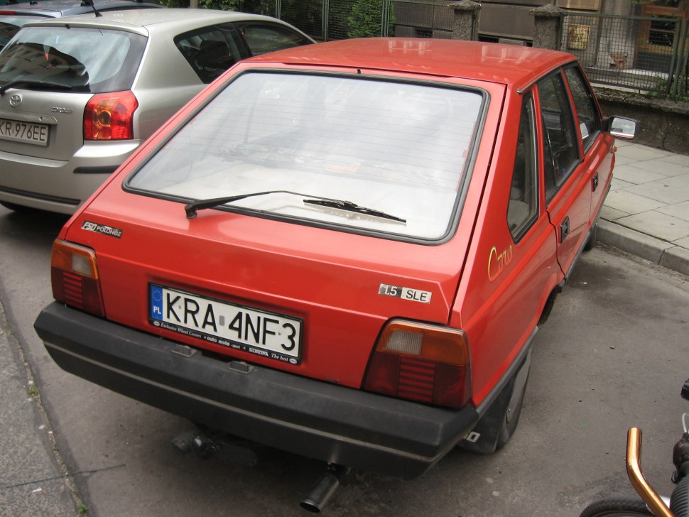 Rear view of classic 1980s hatchback with distinctive badges and rear windshield wiper