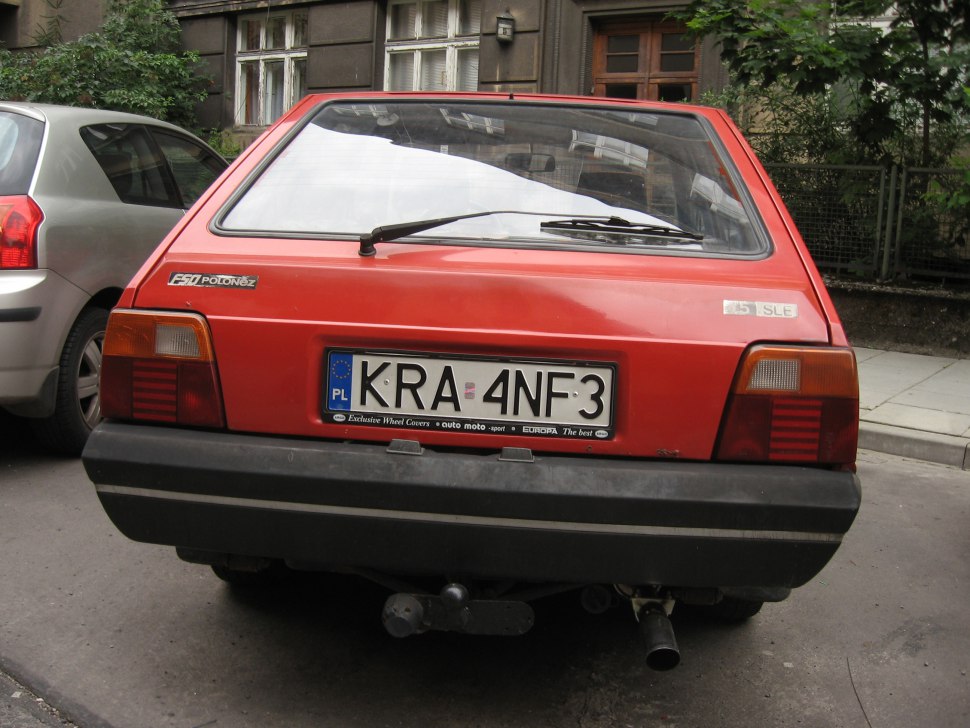 Rear hatchback view with taillights and rear windshield wiper