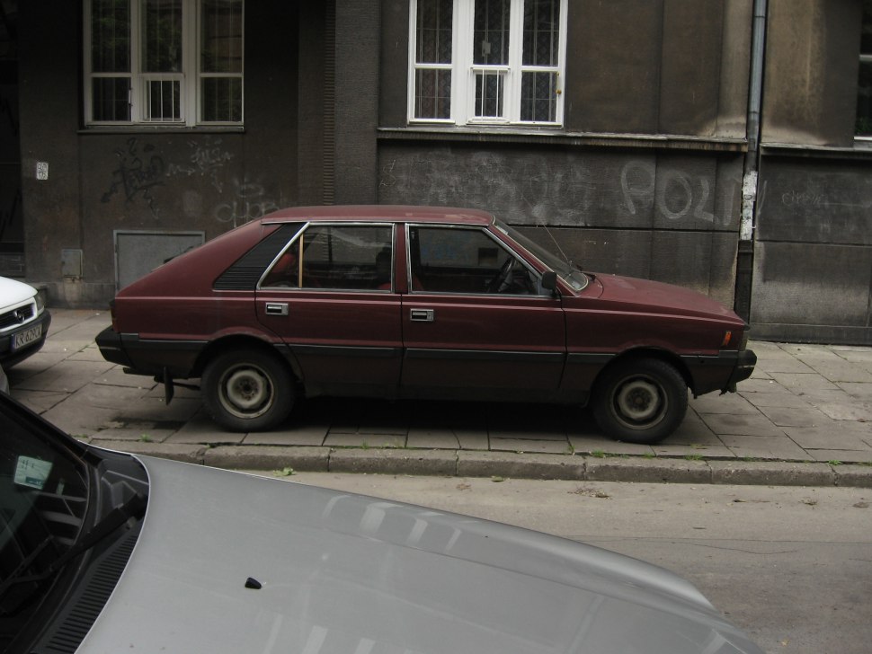 Angular hatchback with flat body panels and four-door side profile
