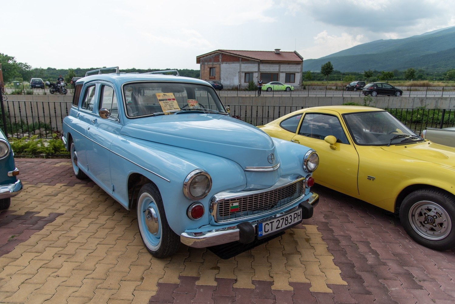 Classic station wagon with rounded headlights and chrome grille in light blue.
