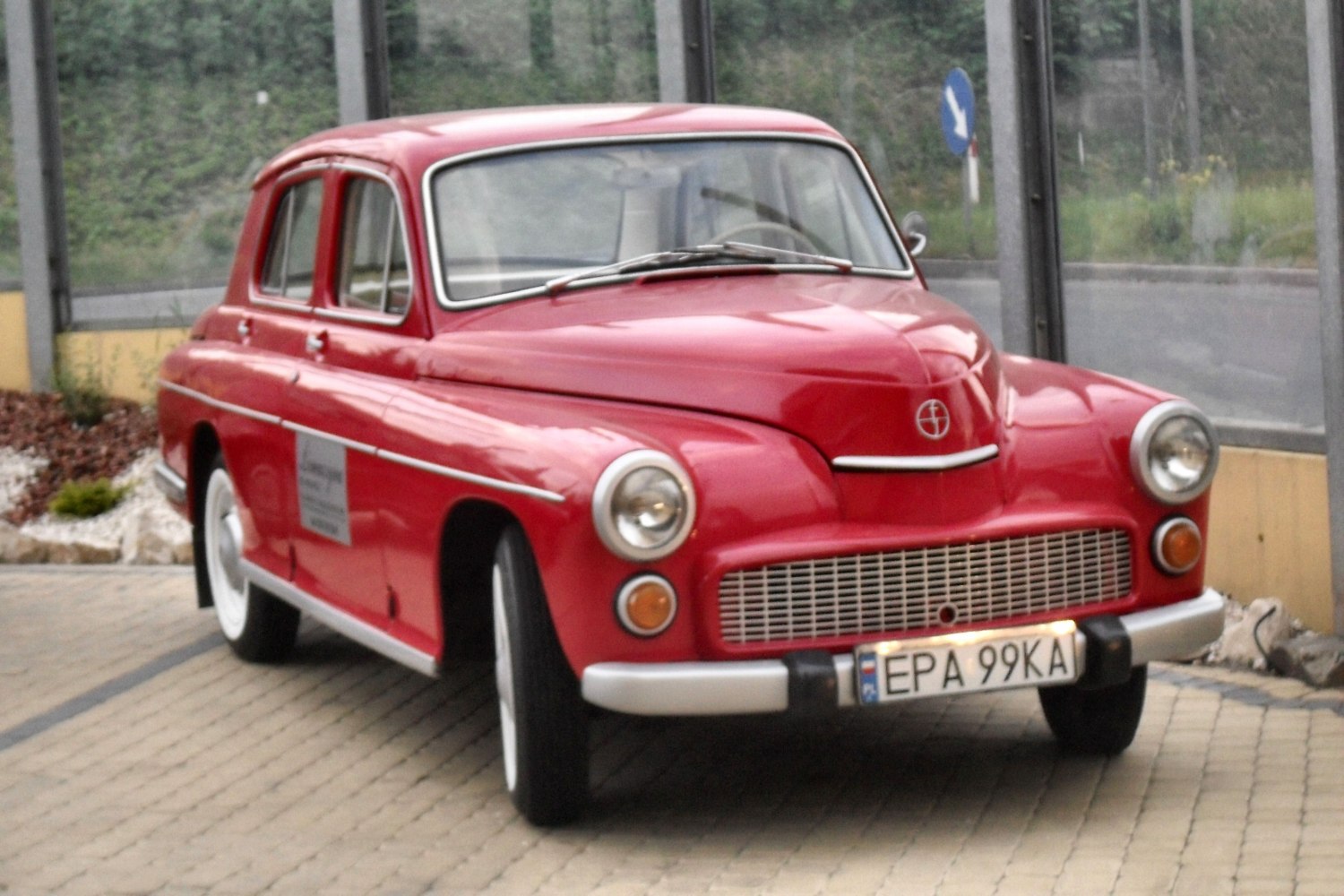 Vintage sedan showcasing round headlights and wide grille
