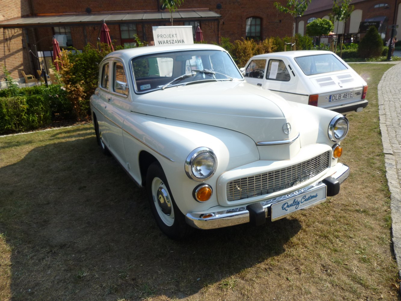 Vintage sedan with round headlights and wide chrome grille