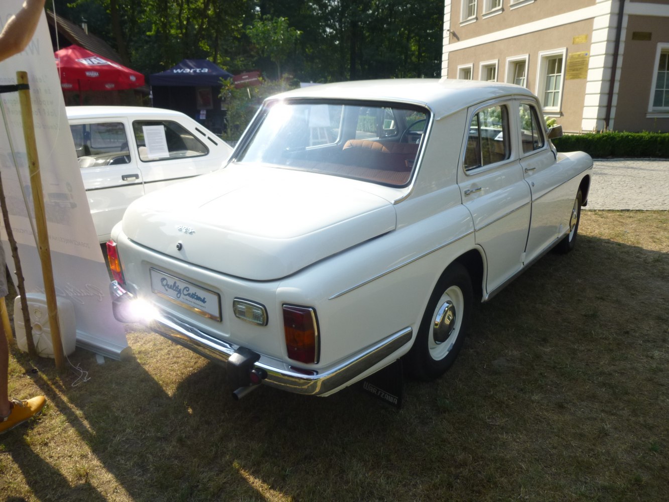 Rear view of a vintage sedan with chrome bumper and classic tail lights.