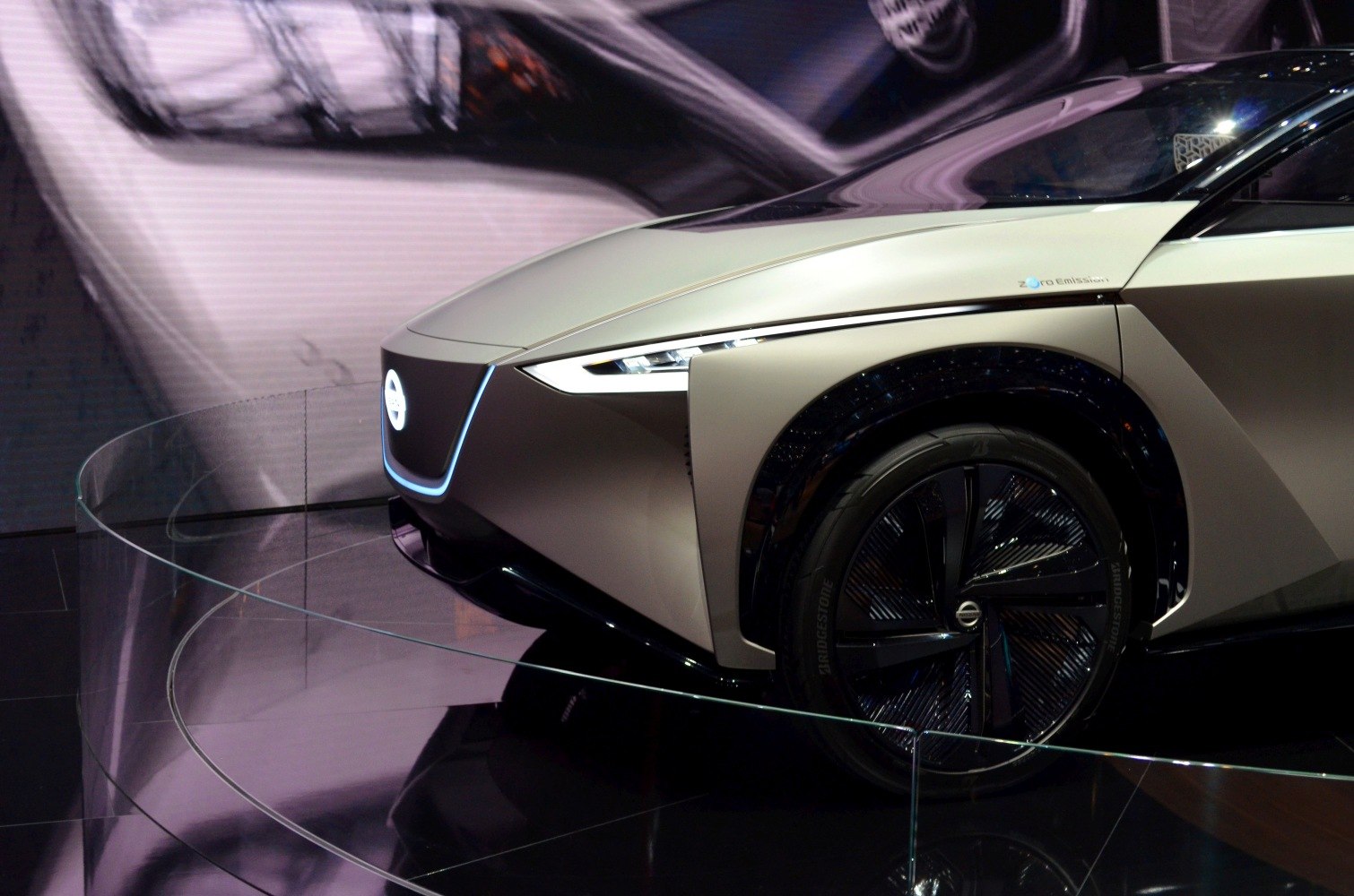 Futuristic front fascia with sleek headlights and unique black wheel design
