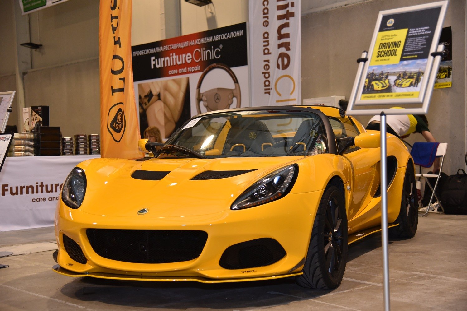 Yellow sporty roadster front with sleek headlights and aggressive air intakes