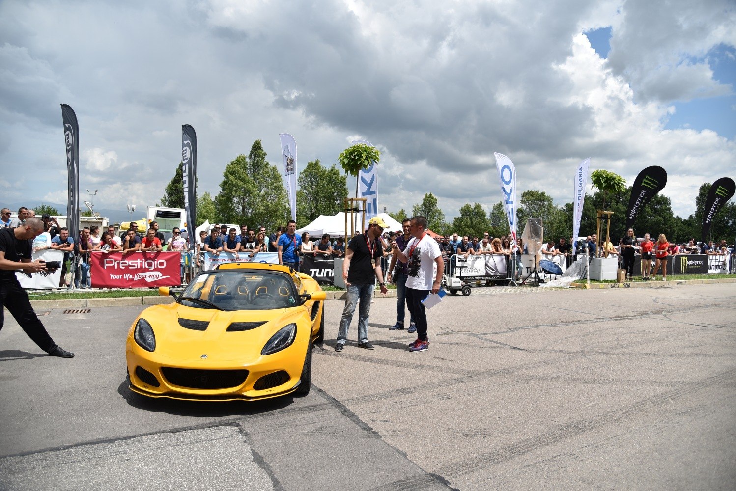 Front view of yellow sporty roadster with aerodynamic vents and sleek headlights