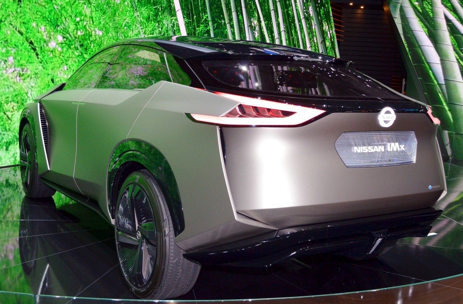 Sleek rear view with angular body and futuristic LED taillights