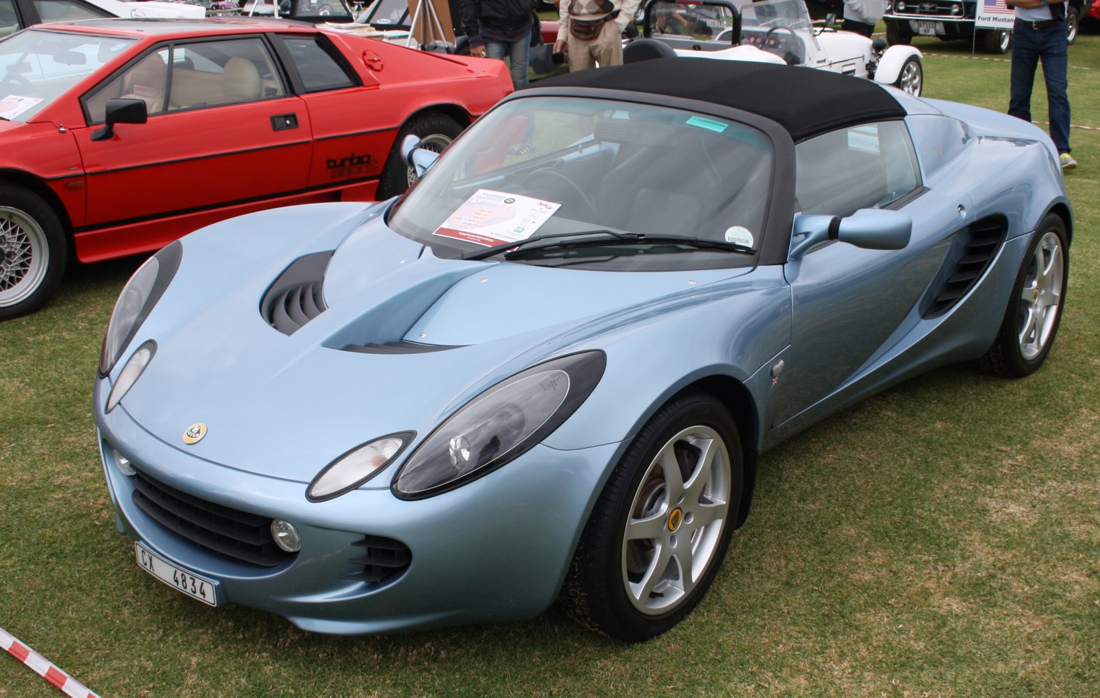 Blue convertible roadster with aerodynamic vents and silver alloy wheels