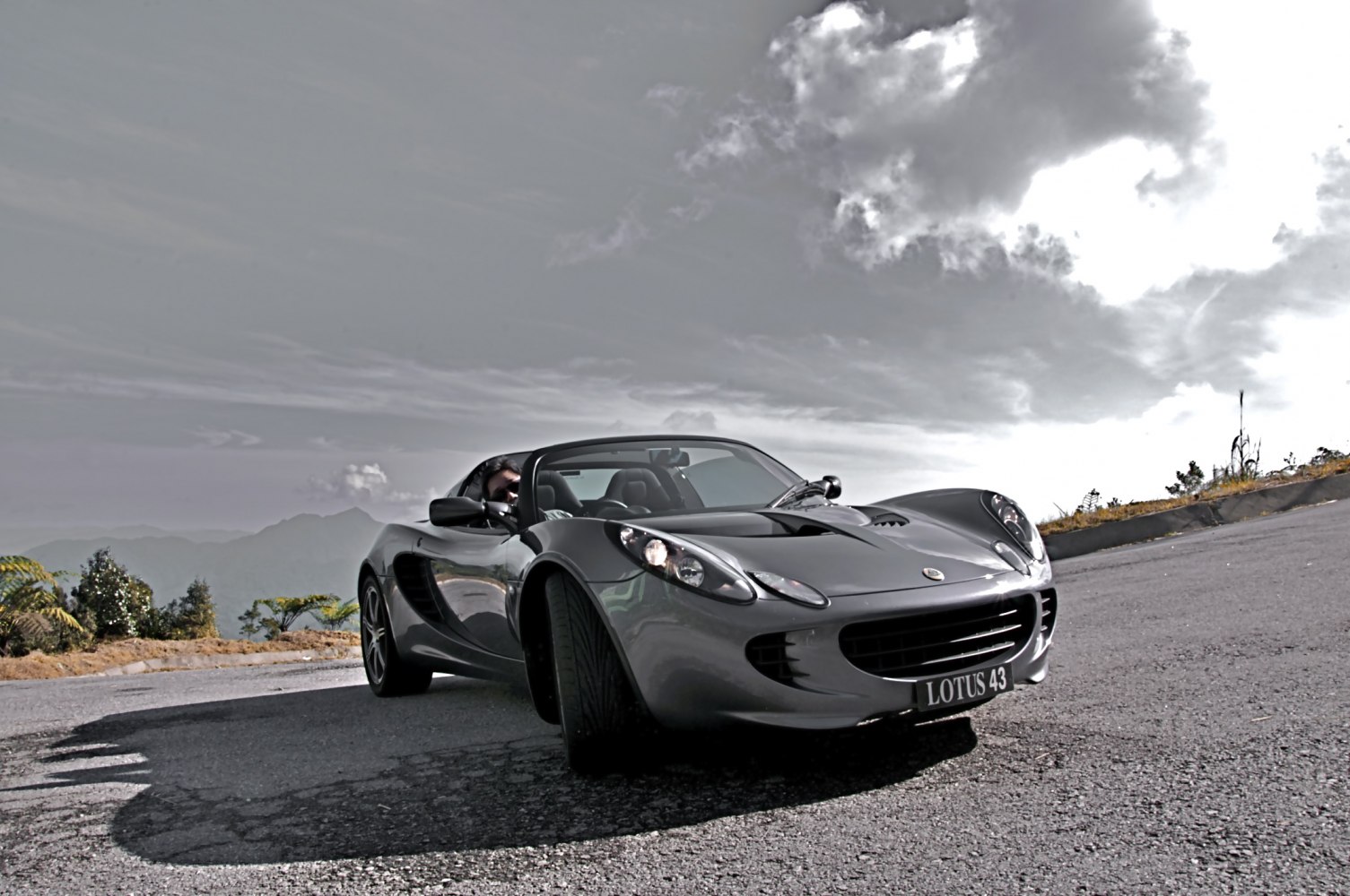 Front angled roadster with sleek headlights and aerodynamic body