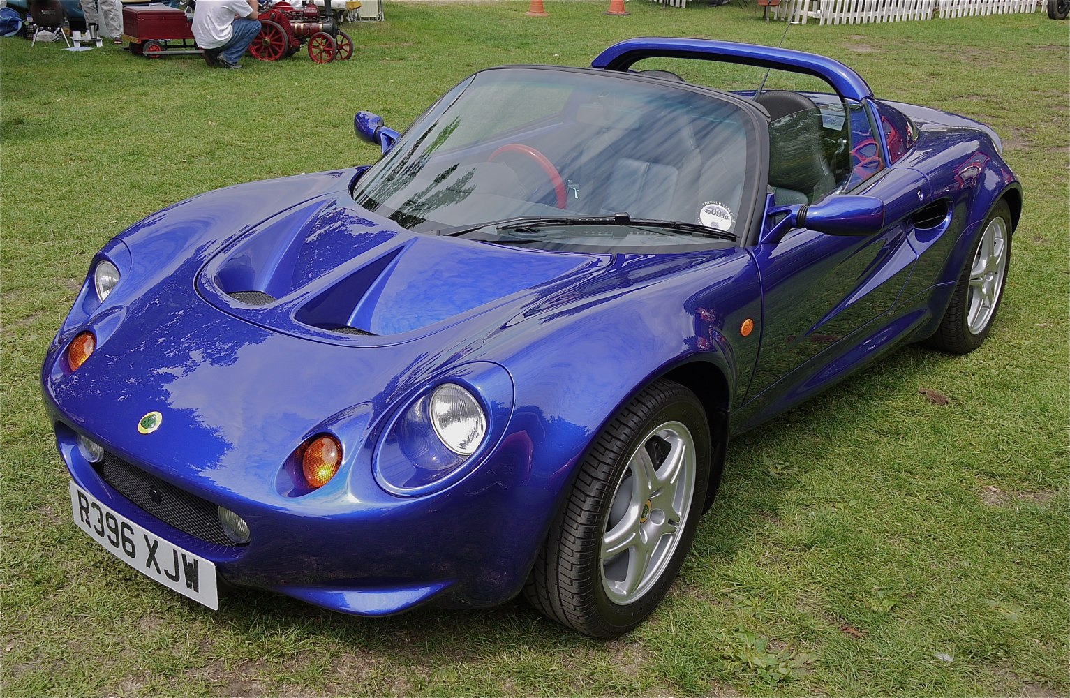 Aerodynamic hood vents and rounded headlights on a lightweight convertible