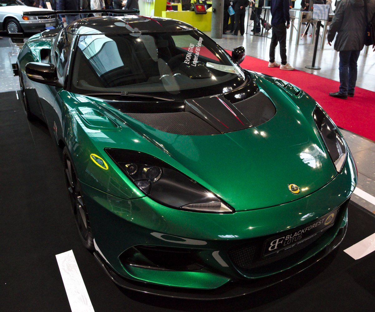 Front view with sharp headlights and carbon fiber hood