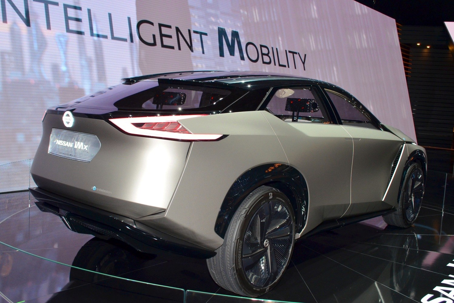 Futuristic electric SUV rear and side profile with sleek angular design and large aerodynamic wheels