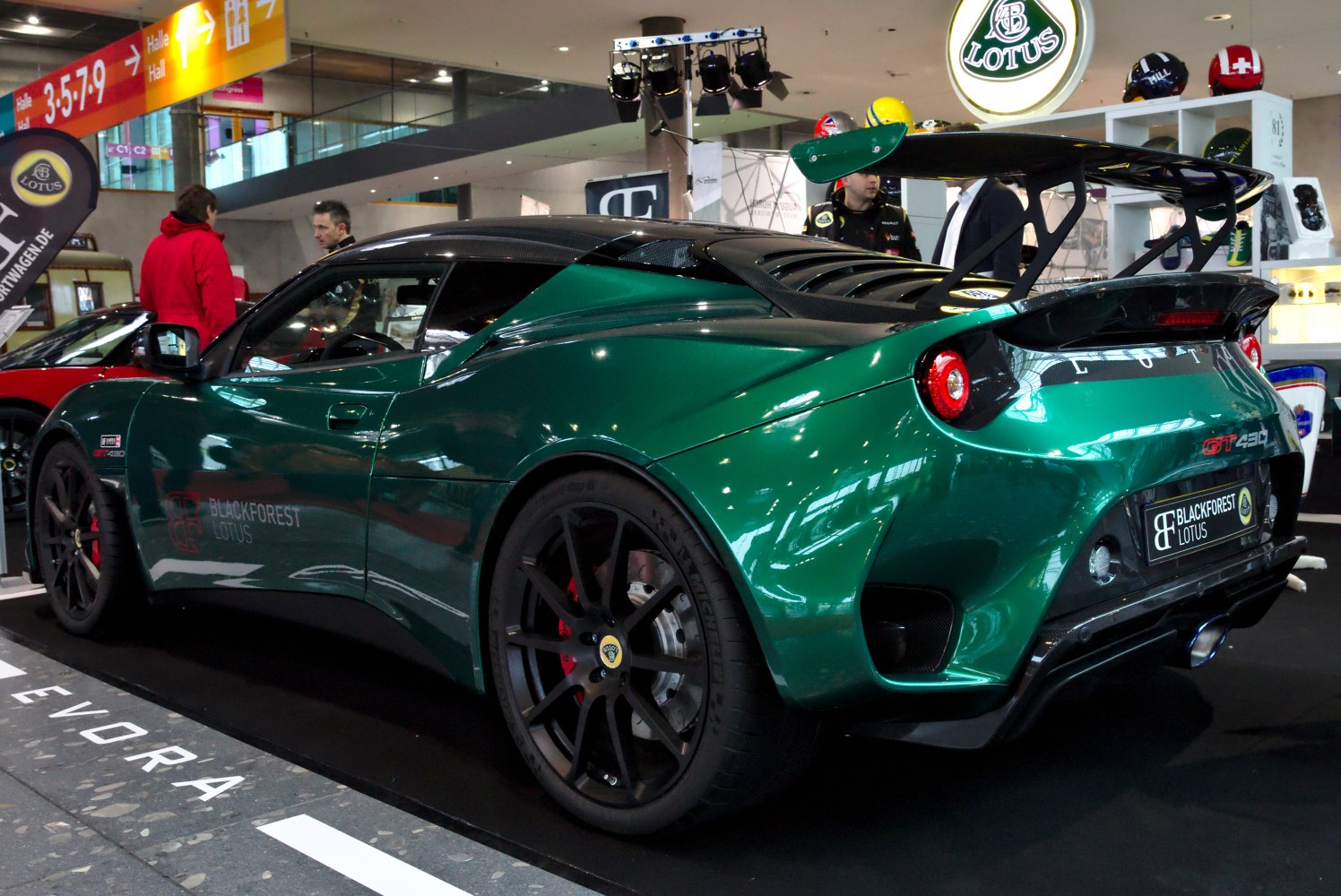 Rear side view with large aerodynamic spoiler and sporty wheels