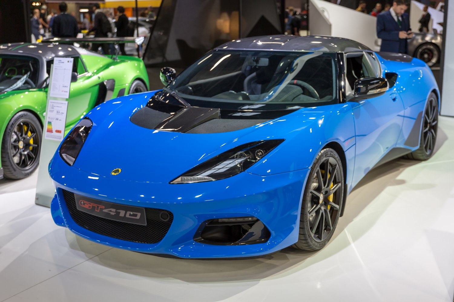 Blue sports car front view with carbon accents and sleek aerodynamics