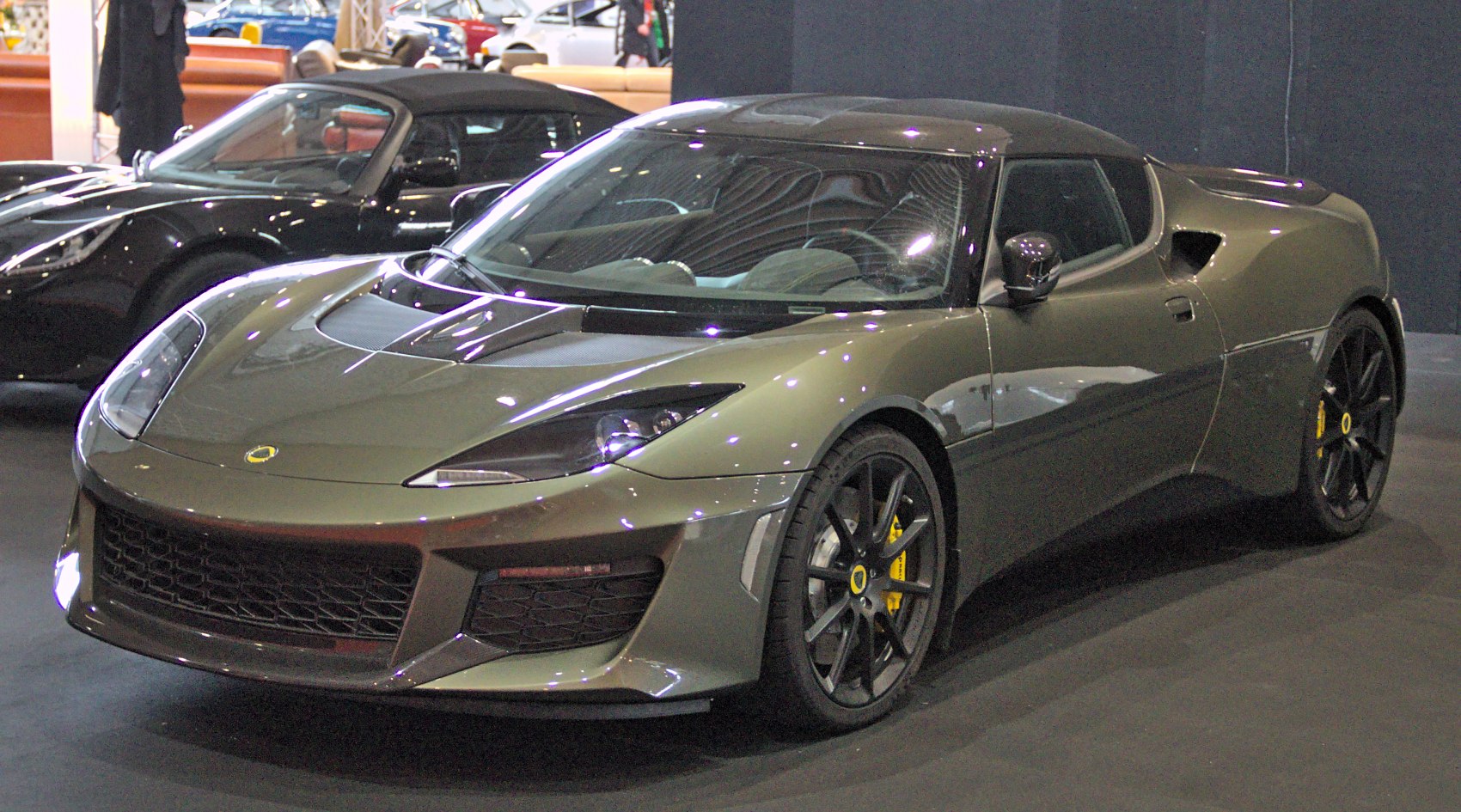 Front three-quarter view of a sleek sports coupe with aerodynamic body and sporty design.