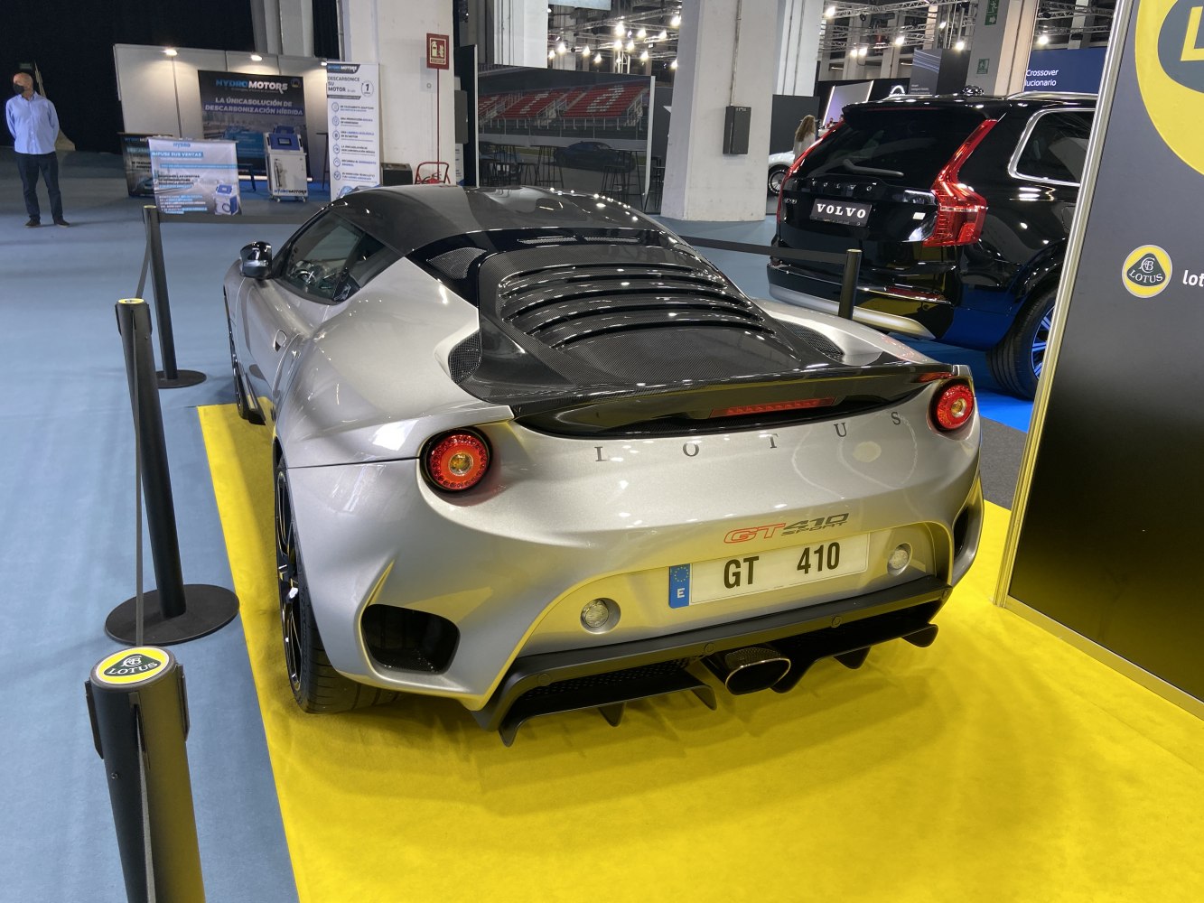 Rear view of a sports coupe with round taillights and performance rear diffuser.
