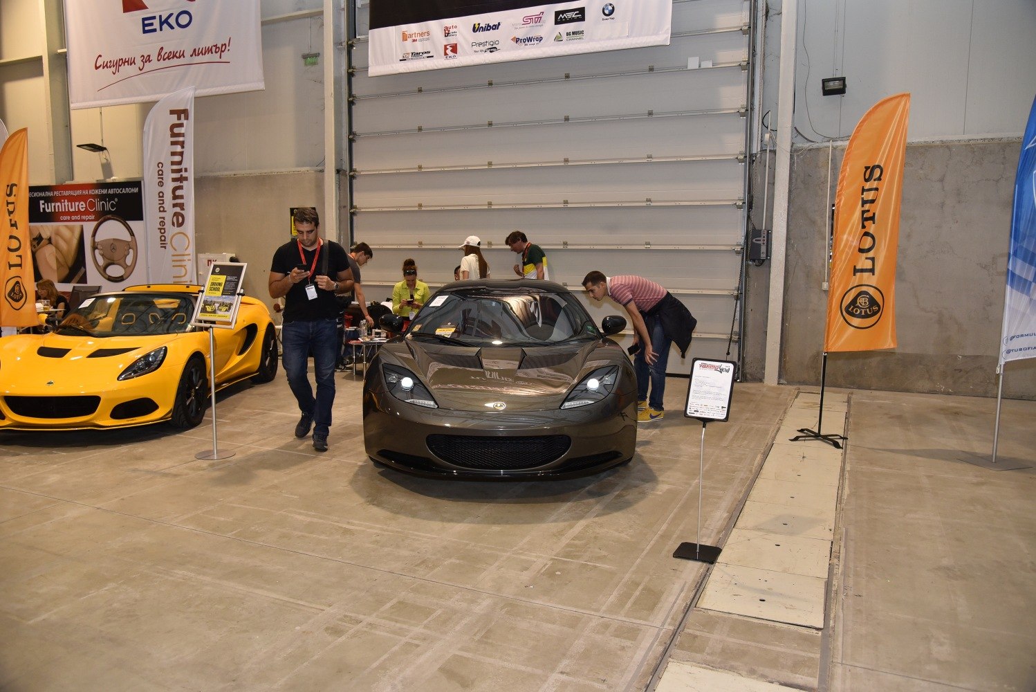 Front view of 2012 Lotus Evora S with headlights on indoors
